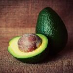 Free fresh avocado cut up on brown