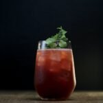 clear drinking glass with red liquid