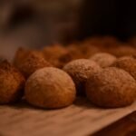 brown rice balls on wooden surface
