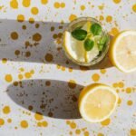 glass of fresh cocktail and pieces of lemon