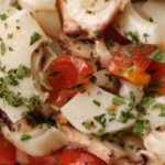 appetizing homemade dish with squids and tomatoes